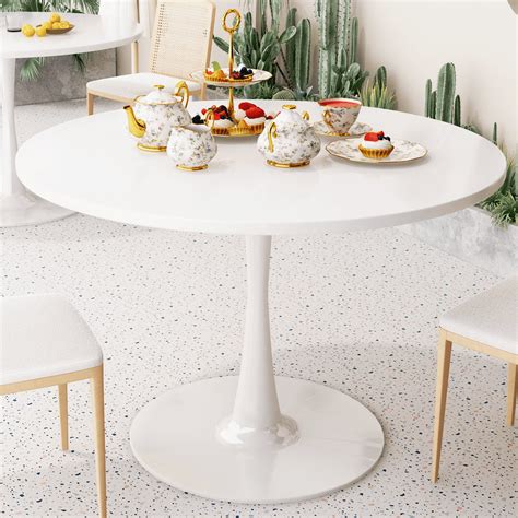 Round white dining table PenalbaWeb.com